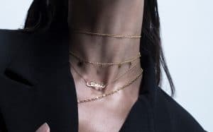 4 layered necklaces on the model's neck