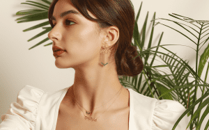 model wearing an earrings and two necklaces inspired from the Lebanese culture